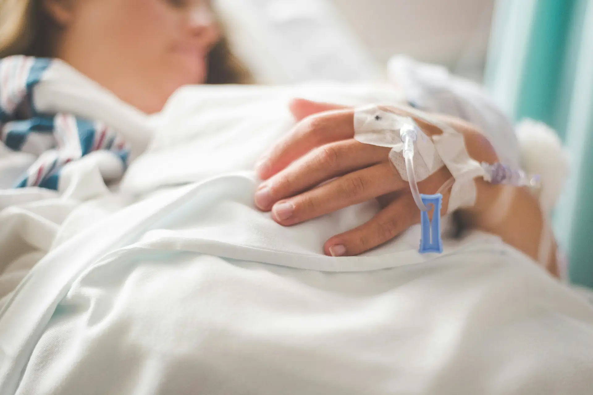 person with cannula in hospital bed